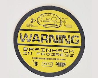 May include: Yellow round warning sign with black text that reads "WARNING BRAINHACK IN PROGRESS". The sign has a black and white illustration of a computer mouse with a circuit board design.