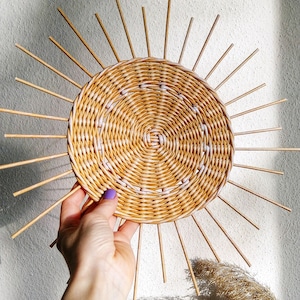 Wicker sun wall decor for boho nursery