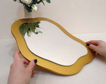 Small decorative asymmetrical wall mirror