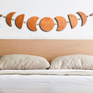 Moon phases wall hanging decor above the bed