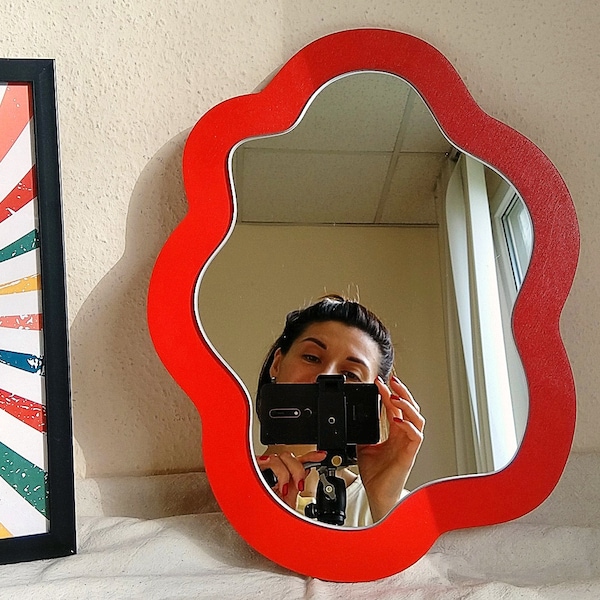 Red asymmetrical mirror wall decor