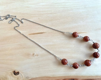 Sparkling goldstone necklace with silver wire and chain