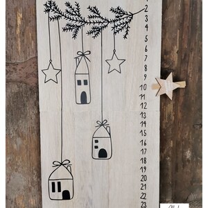 May include: A wooden advent calendar with 24 numbered windows, each with a small house and star hanging from a branch. The calendar is decorated with the text "Allerlei vom Land".