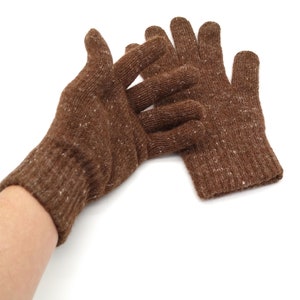 May include: A pair of brown knit gloves with a speckled texture. The gloves are shown on a white background.