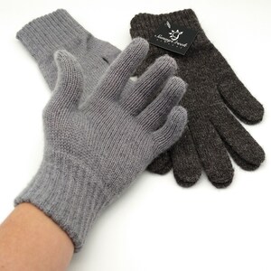May include: Two pairs of knit gloves, one gray and one brown. The gloves are made of a soft, comfortable material and have a simple design.