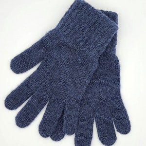 May include: A pair of blue knitted gloves with a textured pattern. The gloves are made of a soft, warm material and are perfect for keeping your hands warm in cold weather.