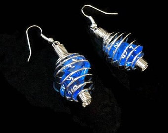 Gamer earrings. Stainless steel spiral cage encloses two rpg dice.