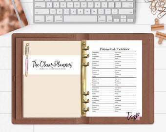 May include: A brown leather bound planner with a gold ring binder. The right page is a password tracker with the title "Password Tracker" and columns for username, email, password, and notes. The left page has the text "The Clever Planner" and a pink pen.