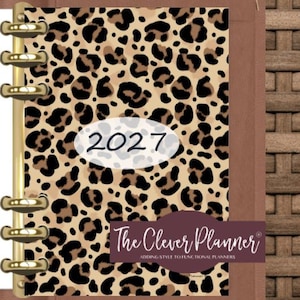 May include: A leopard print planner for 2027 with gold-colored binding rings. The cover features a brown and black spotted pattern with the year 2027 in a white oval. The Clever Planner logo is displayed in a burgundy banner.