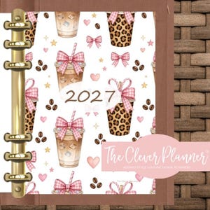 May include: A 2027 planner with a gold metal ring binder mechanism. The cover features a white background with a repeating pattern of iced coffee cups, leopard print cups, pink gingham bows, coffee beans, hearts, and stars. A pink label reads The Clever Planner.