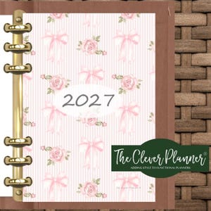 May include: A planner with a gold six-ring binder mechanism featuring a light pink cover with a repeating pattern of pink roses and bows. The center displays the text 2027 in a white oval. A dark green rectangular logo reads The Clever Planner.
