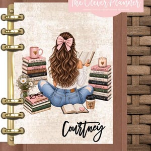 May include: A disc-bound planner cover featuring an illustration of a person with long brown hair and a pink bow, sitting and reading among stacks of books, a coffee cup, a candle, and flowers. The name Courtney is printed in black script.