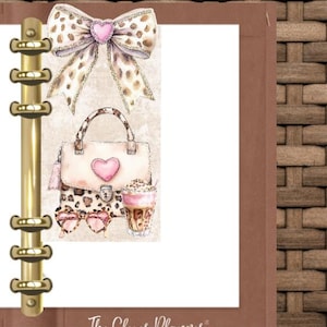 May include: A planner page with a gold binder, featuring illustrations of a leopard print bow, purse, sunglasses, and a latte. The purse and bow have pink heart accents. The text "The Clever Planner" is at the bottom.