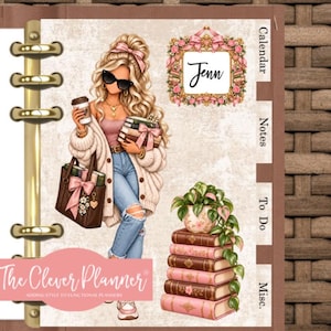 May include: A ring-bound planner featuring a blonde character in sunglasses, a cardigan, and jeans holding books and a coffee cup. The page includes a floral frame with the name Jenn, a stack of books with a plant, and tabs labeled Calendar, Notes, To Do, and Misc.