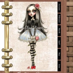 May include: A planner insert featuring a gothic-style illustration of a girl in a blue dress with black and white striped stockings. The insert has gold binder rings and month tabs. The text "The Clever Planner" is visible.