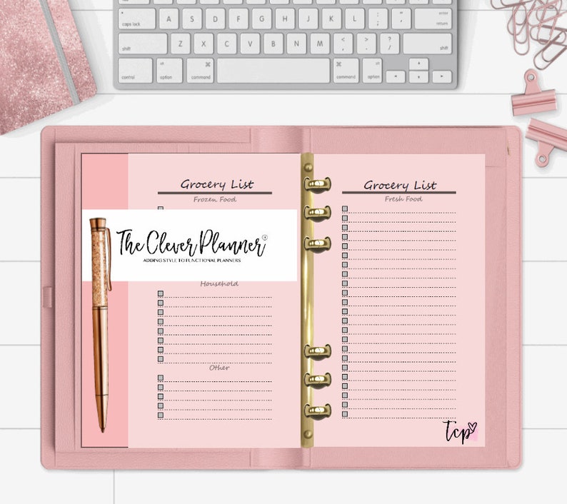 May include: A pink planner with gold rings and two pages open to grocery lists. The left page has a section for frozen food and the right page has a section for fresh food. The planner has the text "The Clever Planner" and "Adding Style to Functional Planners".
