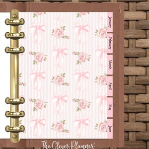 May include: A pink and white planner with a floral pattern and pink bows. The planner has a gold binder and tabs for each month of the year: January, February, March, April, May, and June. The text "The Clever Planner" is at the bottom of the page.