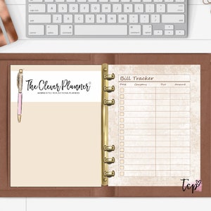 May include: A brown leather bound planner with gold rings. The planner has a white page with the text "The Clever Planner" and a bill tracker page with the text "Bill Tracker" and columns for "Paid", "Company", "Due", and "Amount".