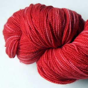Hand dyed red 100% merino superwash sock yarn