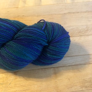 Hand dyed deep navy and forest green 100% merino superwash sock yarn