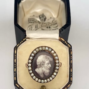 A Greek God Miniature Ring With Pearl Cluster Surround Circa 1800’s