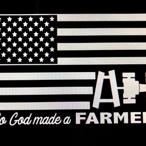 May include: A black and white image of an American flag with a tractor silhouette and the text "So God made a FARMER".