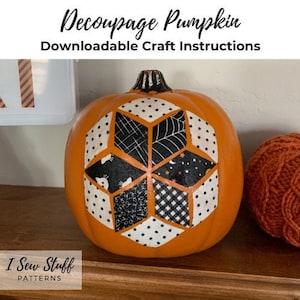 May include: A close-up of an orange pumpkin decorated with a black and white geometric design. The pumpkin is sitting on a wooden surface. The text "Decoupage Pumpkin" and "Downloadable Craft Instructions" is at the top of the image. The text "I Sew Stuff Patterns" is at the bottom of the image.
