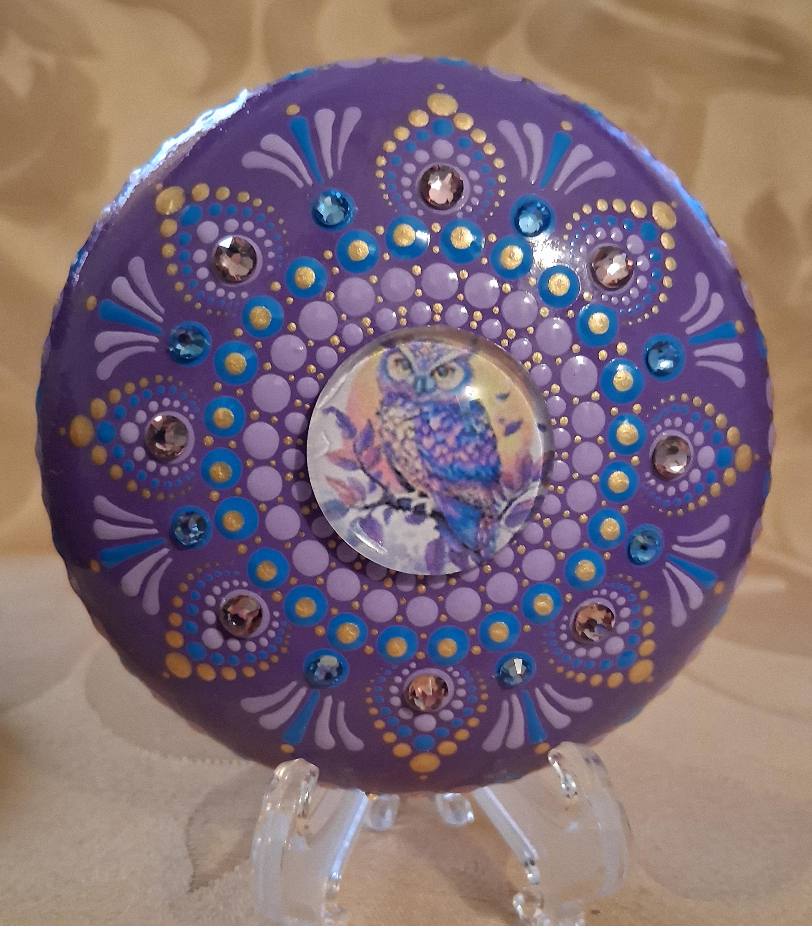 Owl mandala on an art stone with glass crystals