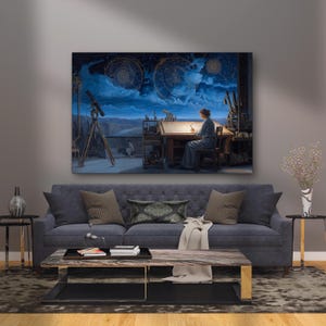 May include: A large canvas print depicting a woman at a desk, illuminated by a lamp, with a night sky and celestial charts above. The scene includes a telescope and other scientific instruments, creating a vintage aesthetic. The print hangs above a blue sofa.