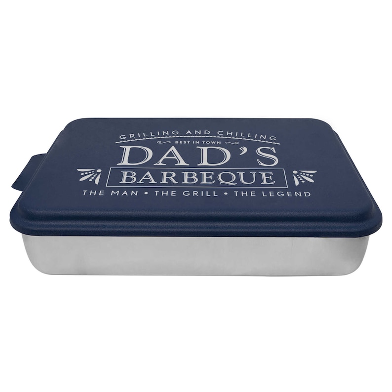May include: A blue baking pan with a lid. The lid has a white design that says "Grilling and Chilling Best in Town Dad's Barbeque The Man The Grill The Legend".