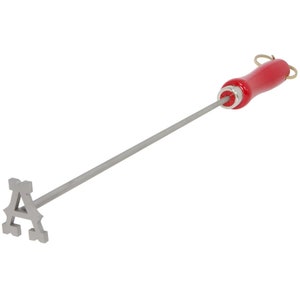 May include: A metal branding iron shaped like the letter "A" with a red wooden handle. The branding iron is attached to a long metal rod.