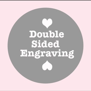 May include: A gray circle with white hearts and the text "Double Sided Engraving" in white.