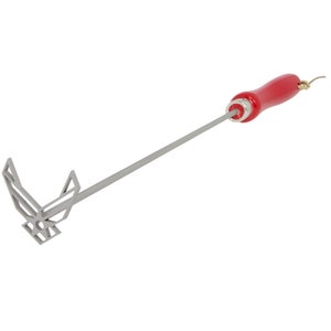 May include: A silver metal grilling tool with a red wooden handle. The tool is shaped like the United States Air Force logo.