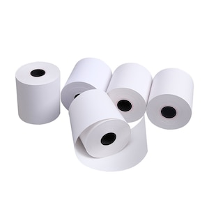 May include: Several rolls of white thermal paper for receipts or point-of-sale systems. The rolls are cylindrical with a black core and are arranged on a white background. One roll is partially unrolled, showing the paper's surface.