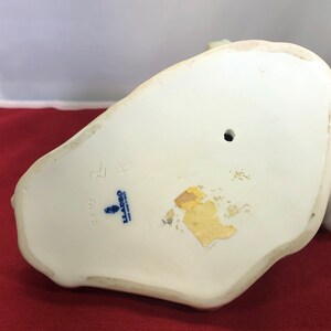 May include: White porcelain figurine with a blue and white Lladro mark on the bottom. The mark includes the number 5528 and the text "Lladro, Spain".