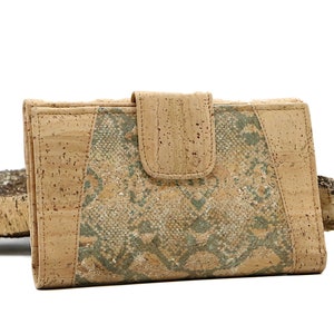 May include: A beige cork wallet with a green and beige snake skin pattern. The wallet has a flap closure and is made of natural cork.