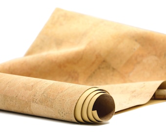May include: A roll of cork sheet material, unrolled and partially rolled up, showing the natural texture of the cork. The cork is a light brown color.