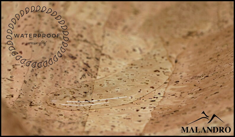 May include: A close-up of a cork surface with a drop of water on it. The cork is light brown with a fine texture. The water drop is clear and round. The text "WATERPROOF" is visible in a circle of raindrops around the water drop.