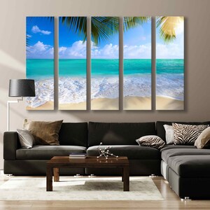 May include: A multi-panel canvas print depicting a tropical beach scene with turquoise water, white sand, and palm trees. The image is divided into four panels, creating a panoramic effect.