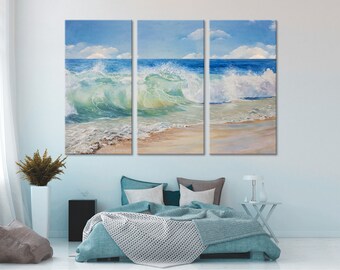 May include: A three-panel canvas print depicting a seascape with crashing waves and a sandy beach. The waves are a vibrant turquoise and green, with white foam crests. The sky is a light blue with fluffy white clouds.