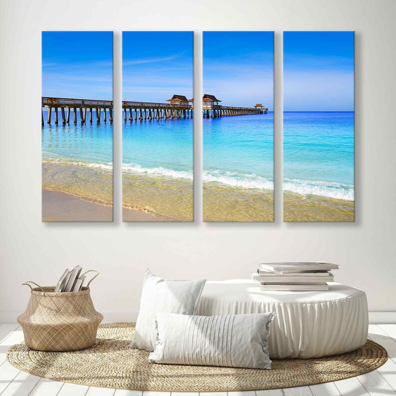 May include: A split canvas print of a wooden pier extending into a turquoise ocean with white sand beach and blue sky.