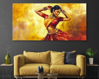 May include: A vibrant canvas print depicts a woman in traditional Indian attire. She is adorned in a red and gold sari, with jewelry. The background features warm yellow and orange hues, creating a dynamic and artistic composition.