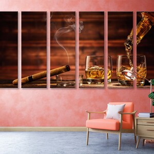 May include: A multi-panel canvas print featuring a wooden background with a lit cigar, smoke, and three glasses of amber liquid being poured from a bottle.