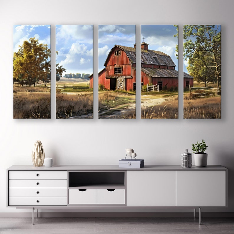 May include: A five-panel canvas art piece depicting a rural landscape. The central focus is a weathered red barn with a wooden door, set against a backdrop of a cloudy sky and fields. The artwork evokes a sense of rustic charm and natural beauty.