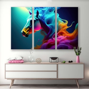May include: A three-panel abstract art print depicting a colourful horse with a flowing mane and tail. The horse is rendered in shades of blue, yellow, pink, and purple, creating a vibrant and dynamic composition.