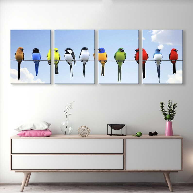 May include: A vibrant multi-panel canvas print featuring a row of colorful birds perched on a wire against a light blue sky. The birds are in various colors including red, blue, green, yellow, and black. The artwork is a nature-themed piece suitable for home decor, adding a pop of color to any room.  The birds are depicted realistically, showcasing their plumage and details. The print is divided into three panels for a modern, gallery-style display.