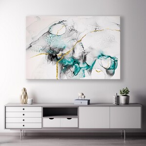 May include: Abstract art print featuring teal, black and gold accents. The print depicts swirling, organic shapes and lines.