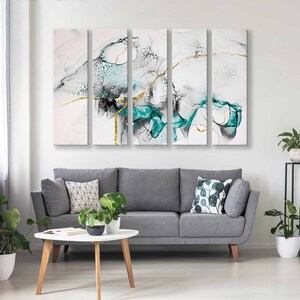 May include: A four-piece abstract canvas wall art set featuring a teal and white colour scheme with gold accents. The artwork depicts a swirling, abstract design with a modern aesthetic.