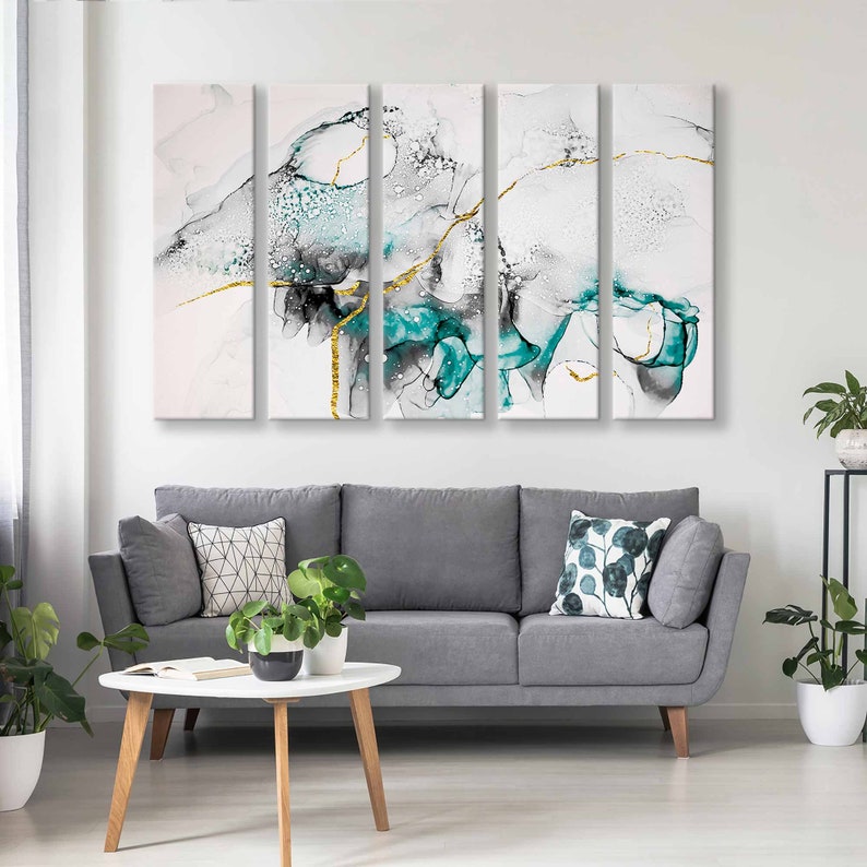 May include: A four-piece abstract canvas wall art set featuring a teal and white colour scheme with gold accents. The artwork depicts a swirling, abstract design with a modern aesthetic.