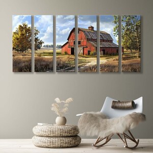 May include: A multi-panel canvas print depicting a rural landscape with a weathered red barn under a cloudy sky. The artwork features a dirt path leading to the barn, surrounded by fields and trees. The overall color palette is warm, with shades of red, brown, and green.